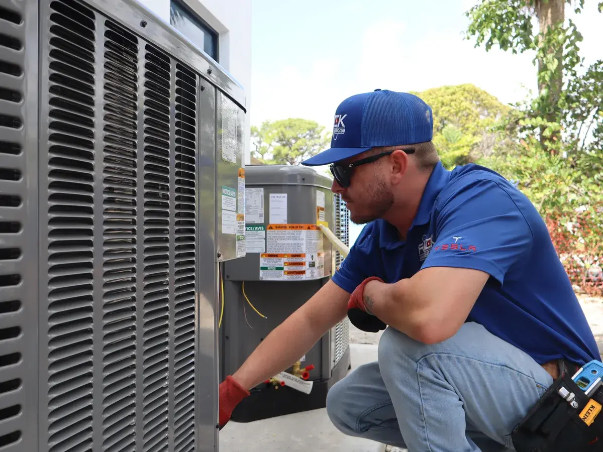 Rack Air technician servicing a condenser unit in Volusia County