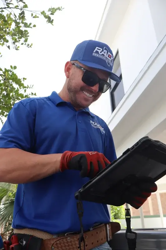 Rack Air technician reviewing new AC installation in DeLand FL