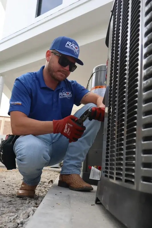Rack Air technician repairing an AC condenser in DeLand FL